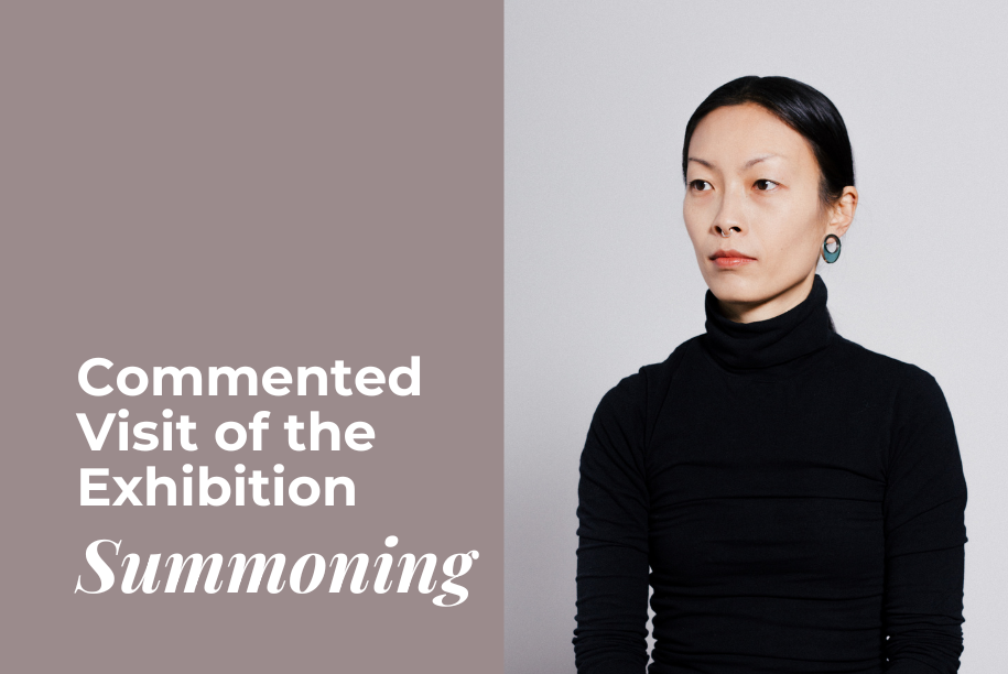 The image shows a promotional visual for an art exhibition titled "Summoning." On the left side, text in English reads, "Commented Visit of the Exhibition Summoning" in white, placed on a muted taupe background. On the right side, a person with a neutral expression and dark attire sits against a light grey background, looking off-camera to the right. The person has straight black hair pulled back, wears a black turtleneck, and has visible earrings.