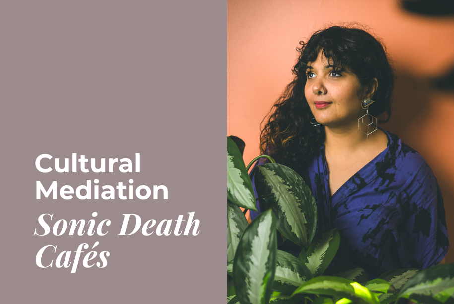 Salima, a brown skinned woman with long curly dark hair stares into the distance. She is surrounded by monstera plants contrasted against a peachy pink wall.